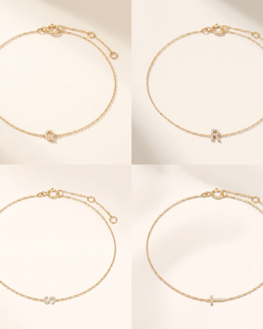 Detail Image - 14k solid gold pave diamond initial bracelets shown in multiple letter options on delicate cable chains