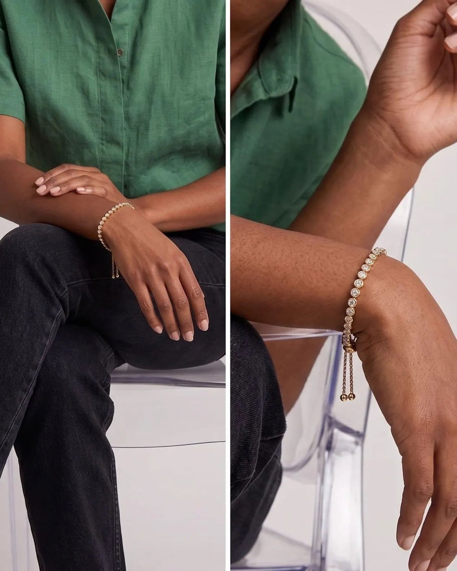 Adjustable bezel tennis bracelet with sparkling stones styled on the wrist worn on model