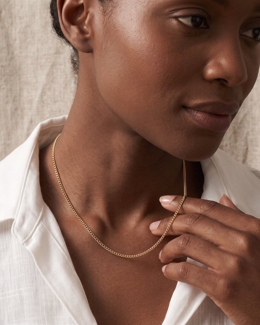 Model Image - dainty 18k gold baby curb chain necklace with a slim minimal profile worn on model
