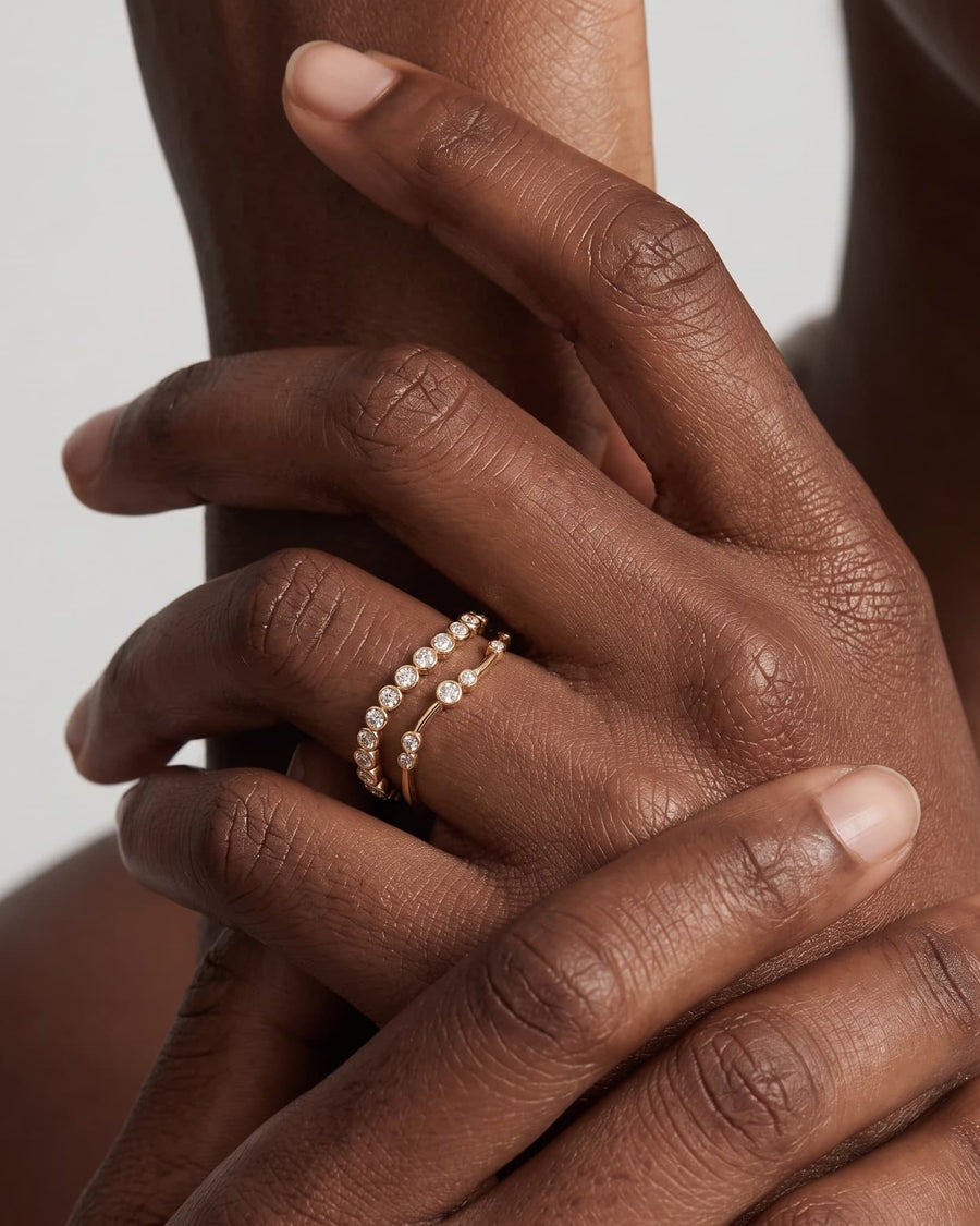 Model Image - 14k solid gold open bezel stacking ring with round lab-grown diamonds styled on the finger worn on model
