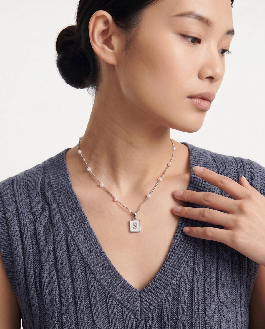 Model Image - mother of pearl initial pendant necklace with beaded chain detail worn on model
