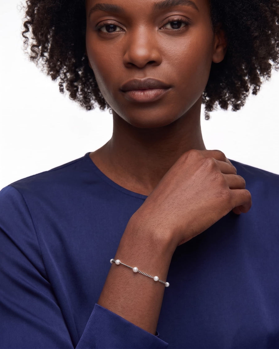 Model Image - Stainless steel satellite pearl chain bracelet with delicate bead accents on the wrist worn on model