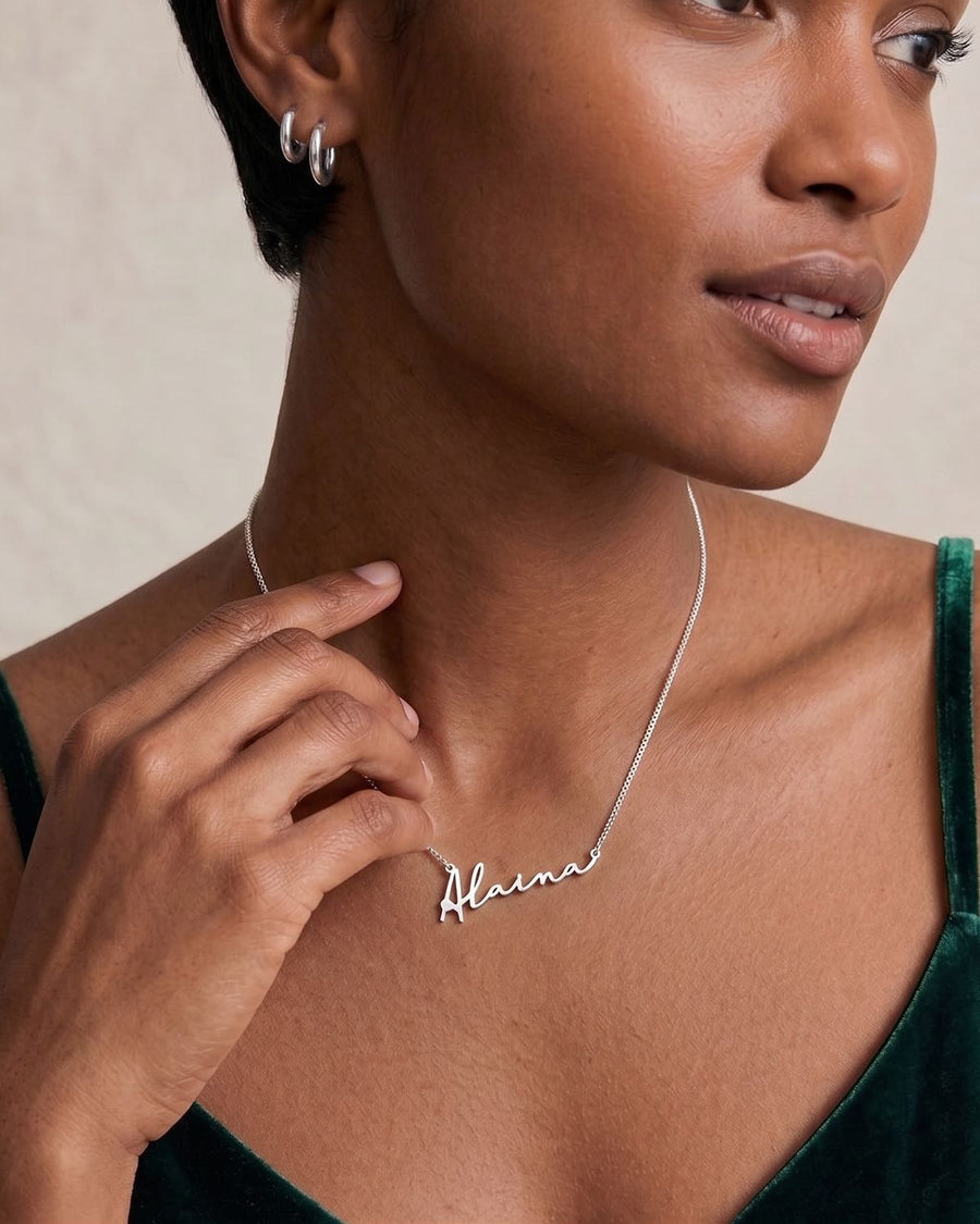 Model Image - personalized script name necklace on a chain worn at the collarbone worn on model