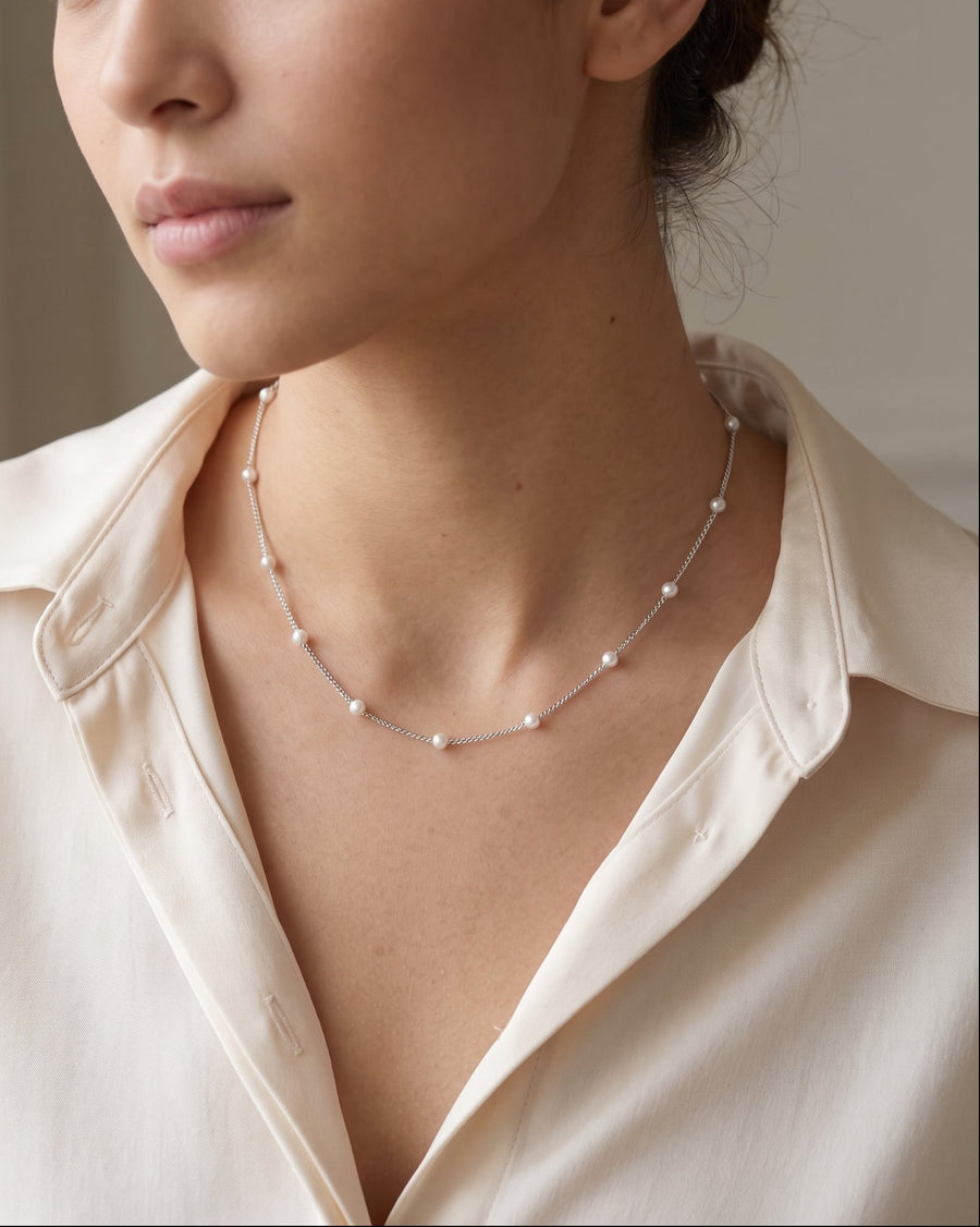 Model Image - Silver-toned satellite pearl bead chain necklace layered at the neckline worn on model